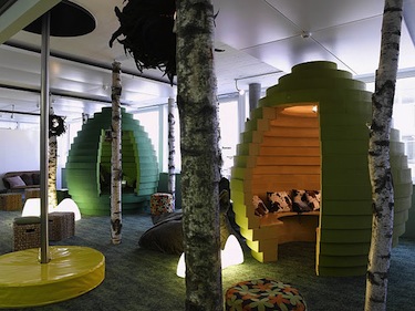 an office with trees, pods to sit in and a bat-pole