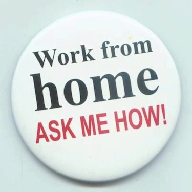 a wearable button reading 'work from home - ask me how'